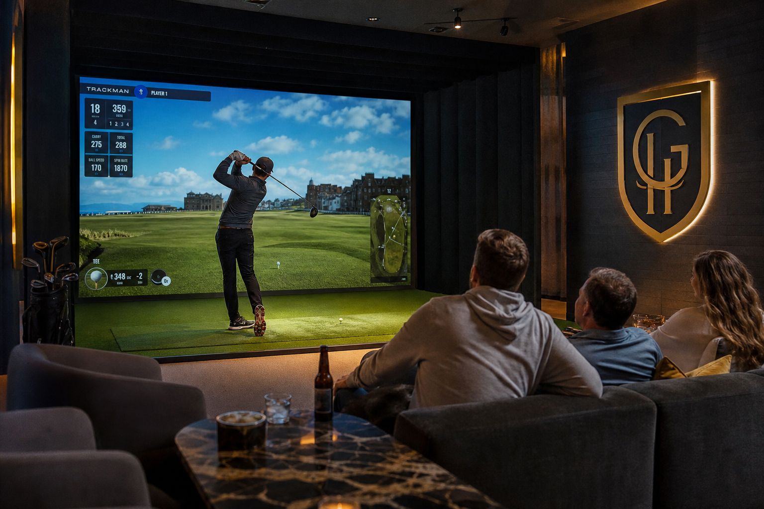 Indoor golf simulator experience with a player swinging a golf club, large screen displaying golf course visuals, and spectators enjoying drinks in a cozy lounge setting.